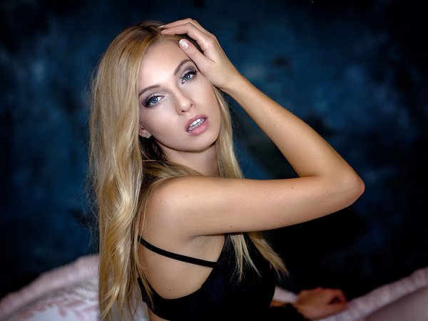 bare shoulders, black dress, blonde, blue eyes, bokeh, Cyril Max, depth of field, dress, face, girl, hand in hair, hand on head, jana, lips, long hair, looking at camera, looking at viewer, model, mouth, open mouth, photo, photographer, portrait, sensual gaze, straight hair, straps