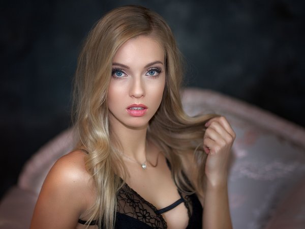 bare shoulders, black dress, blonde, blue eyes, depth of field, dress, face, girl, lips, long hair, looking at camera, looking at viewer, model, mouth, necklace, open mouth, photo, portrait, strap