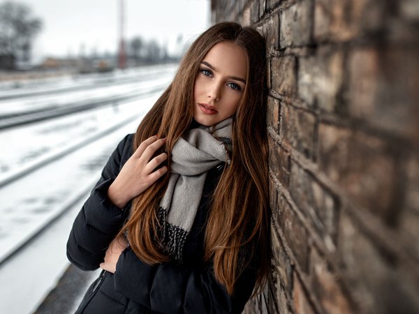 blue eyes, bricks, brunette, coat, depth of field, face, girl, lips, long hair, looking at camera, looking at viewer, model, mouth, photo, photographer, portrait, scarf, snow, Sonny Bui, straight hair, wall